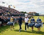 Elite tour golfers walking down the 18th fairway with Callaway staff tour bags