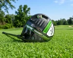 Callaway Epic Max driver showing green and black sole with Jailbreak Speed Frame on fairway turf