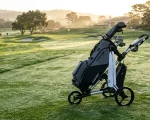 Kaddey Golf Switch 2-wheel trolley with minimalist golf bag on course fairway