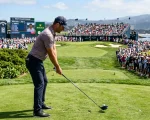 Professional tour golfer with Callaway driver on tournament tee box